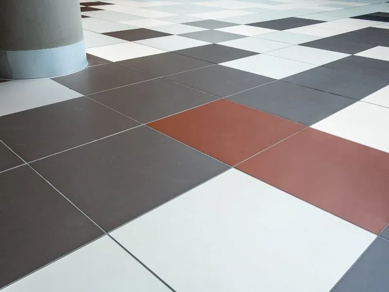 dark brown, wine and white colour square tiles in a commercial site near canberra