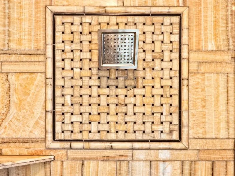 orange ceiling bathroom tiles with square shower head