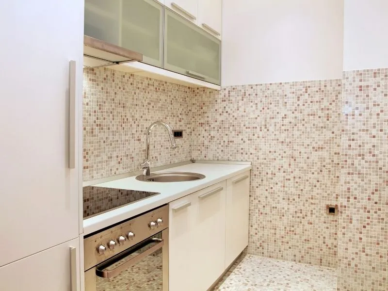 mosaic kitchen cream and brown tiles with oven and sink