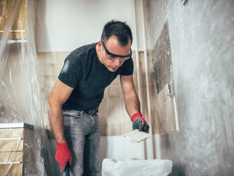 Tiler contractor organising tiles in a kitchen in canberra