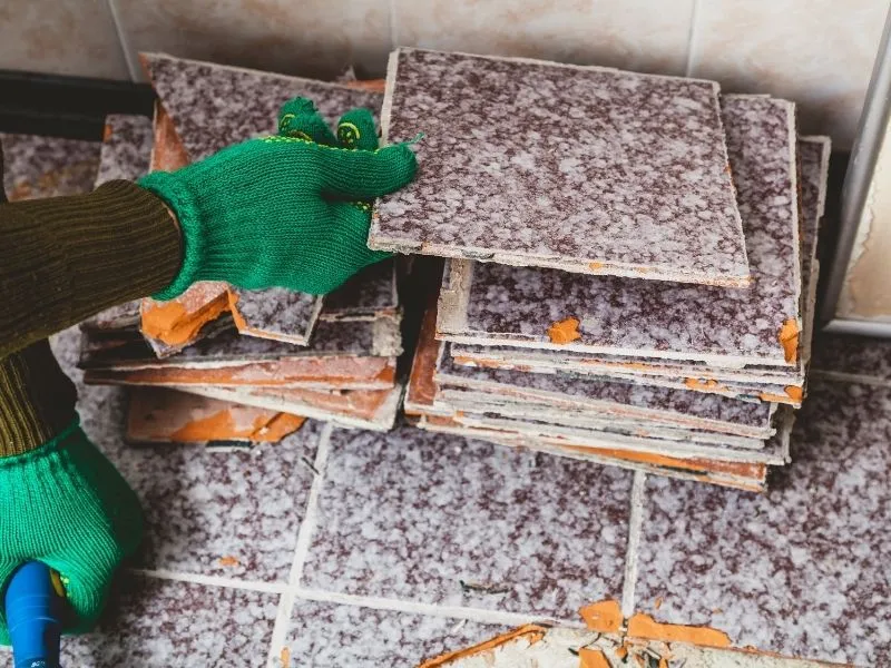 Our Tilers in Canberra piling up square tiles violet and white colour
